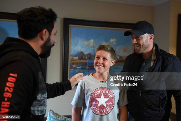 Jacaranda FM DJ Martin Bester, 14-year-old Leo Sadler with his role model AB de Villiers at his home during an arranged surprise meeting on June 05,...