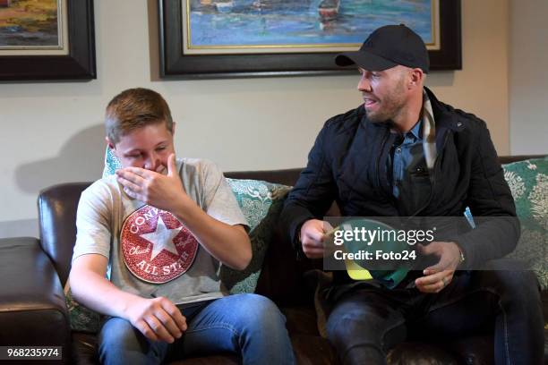 Year-old Leo Sadler meets his role model AB de Villiers at his home during an arranged surprise meeting on June 05, 2018 in Pretoria, South Africa....