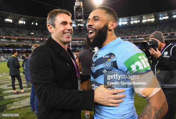 Blues coach Brad Fittler and Josh Addo-Carr of the Blues celebrate winning game one of the State Of Origin series between the Queensland Maroons and...