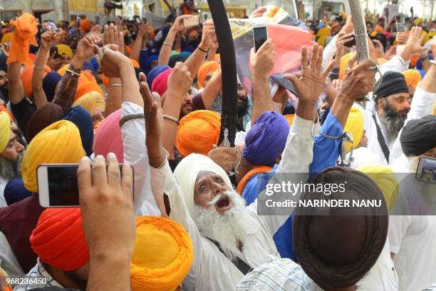 Indian Sikh radical activists shout pro-Khalistan slogans on the occasion of 34th anniversary of Operation Blue Star at the Golden temple in Amritsar...