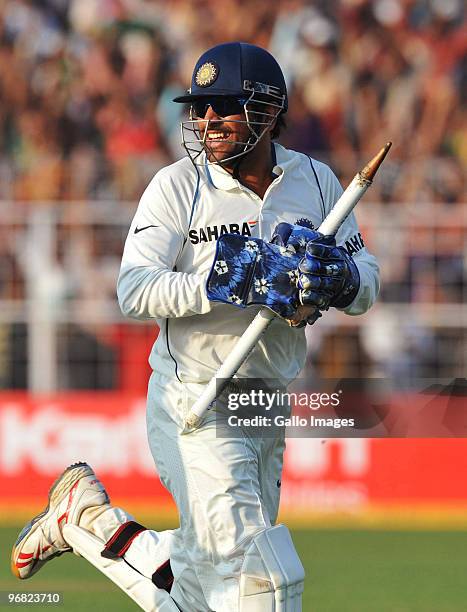 Mahendra Singh Dhoni of India celebrates victory with 10 balls remaining during day five of the Second Test match between India and South Africa at...