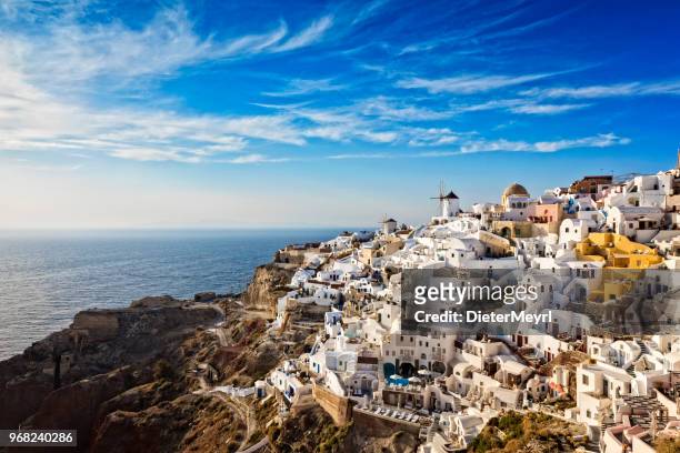 oia village in santorini island with famous churches, greece - greece stock pictures, royalty-free photos & images