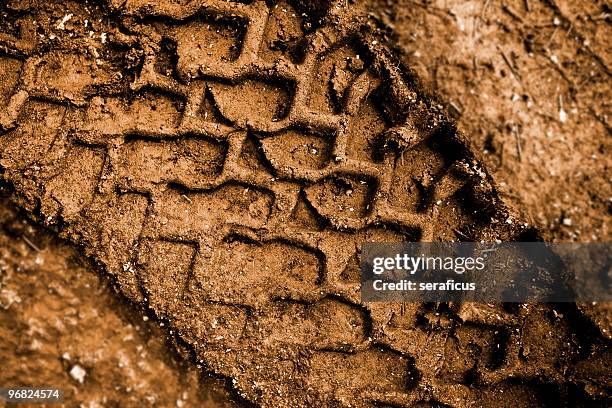 tracks in the mud - tyre track stock pictures, royalty-free photos & images