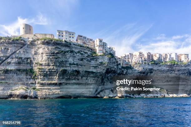 view of bonifacio old town built on top of cliff rocks, corsica island - balagne stock-fotos und bilder