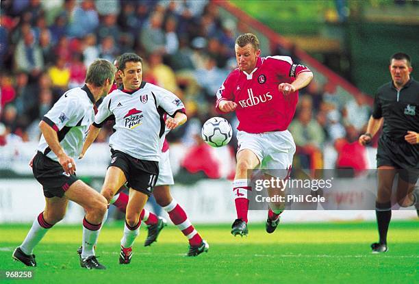 Graham Stuart of Charlton takes on Fulham's John Collins and Kit Symons during the FA Barclaycard Premiership match between Charlton Athletic and...