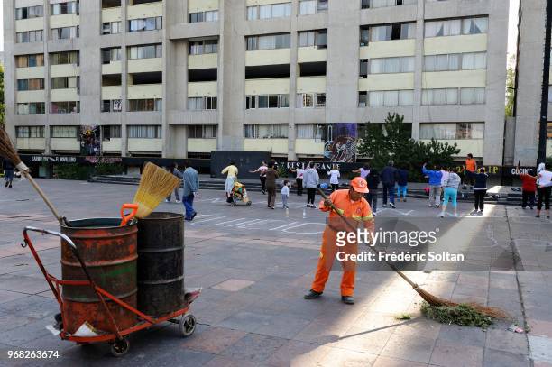 Street cleaner on the Plaza de las Tres Culturas is the main square within the Tlatelolco neighbourhood of Mexico City. The name 'Three Cultures' is...