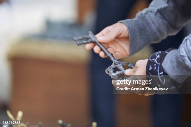 tourist choosing souvenir at the gift shop. istanbul, turkey - arman zhenikeyev stock pictures, royalty-free photos & images