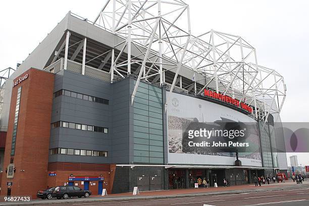 Giant composite picture showing Old Trafford stadium throughout its 100 year history adorns the East Stand at Old Trafford on February 18, 2010 in...