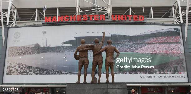 Giant composite picture showing Old Trafford stadium throughout its 100 year history adorns the East Stand at Old Trafford on February 18, 2010 in...