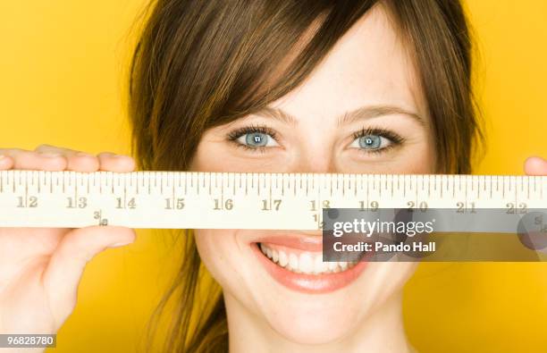 Lady With Ruler Young Woman Holding Wooden Ruler In Front Of Face High-Res Stock Photo ...