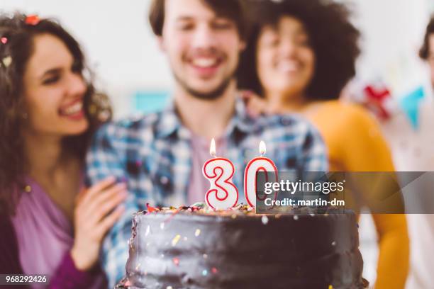 man celebrating 30th birthday with friends - 30th birthday stock pictures, royalty-free photos & images