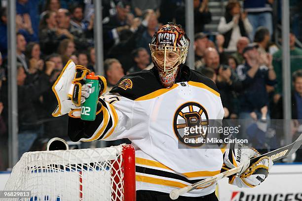 Goaltender Tuukka Rask of the Boston Bruins gets a drink during a break in the play against the Tampa Bay Lightning at the St. Pete Times Forum on...