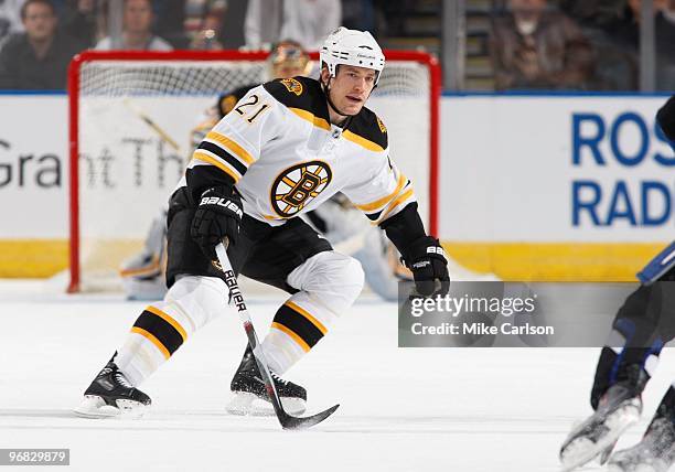 Andrew Ference of the Boston Bruins skates against the Tampa Bay Lightning at the St. Pete Times Forum on February 11, 2010 in Tampa, Florida.