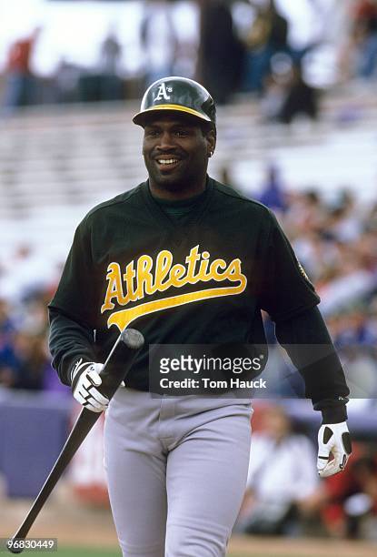 Tim Raines of the Oakland Athletics walks off the field during the spring training day game against the Anaheim Angeles at Tempe Diablo Stadium on...
