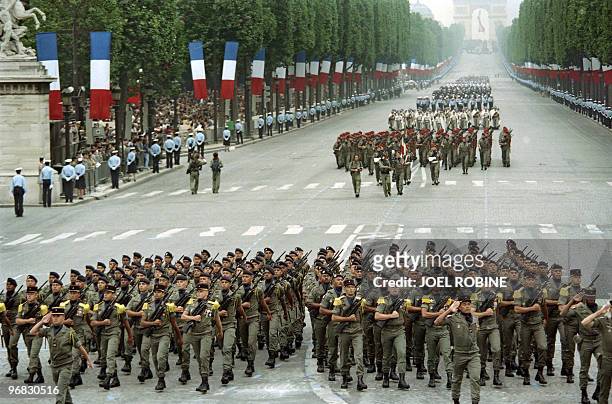 An unit of troupes de marine soldiers known in French as marsouins parade from the Arch of Triumph on July 14 during the Bastille day parade en route...