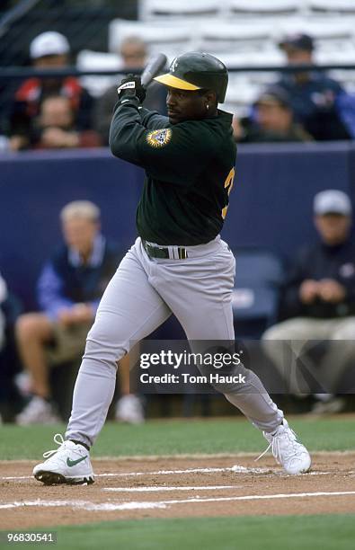 Tim Raines of the Oakland Athletics gets ready at bat during the spring training day game against the Anaheim Angeles at Tempe Diablo Stadium on...