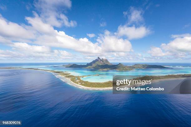 aerial view of the island of bora bora, french polynesia - bora bora fotografías e imágenes de stock