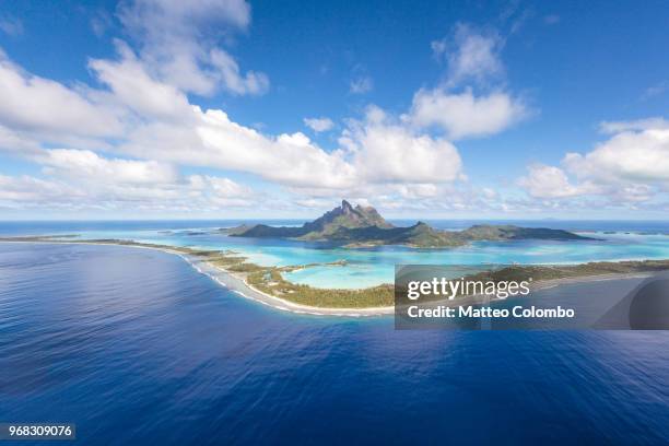 aerial view of the island of bora bora, french polynesia - french polynesia stockfoto's en -beelden