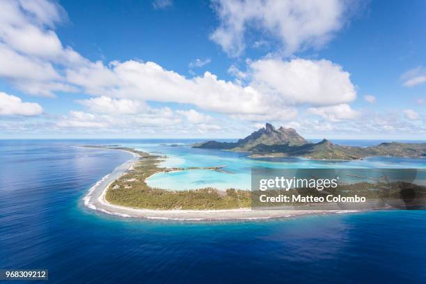 aerial view of the island of bora bora, french polynesia - bora bora atoll stock-fotos und bilder