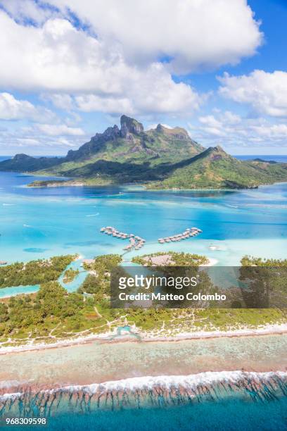 aerial view of the island of bora bora, french polynesia - atoll stock pictures, royalty-free photos & images