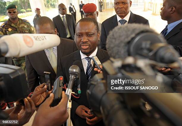Ivory Coast's Prime Minister Guillaume Soro talks with media at the presidential palace in Yamoussoukro on February 18, 2010 after a meeting with...