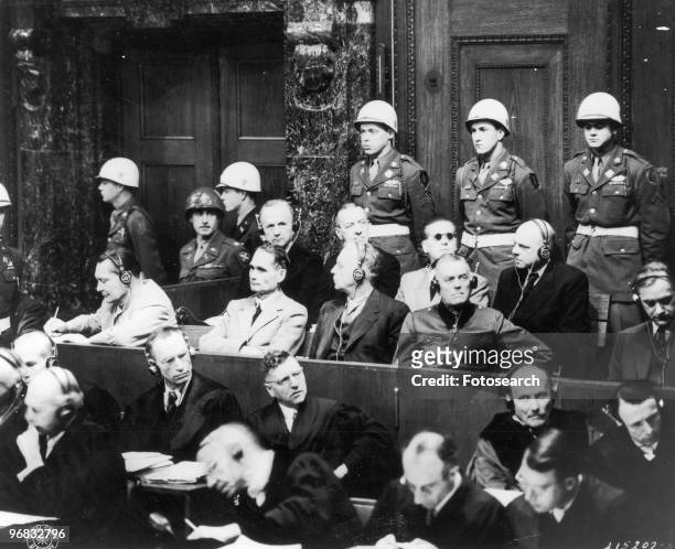 Photograph of Top Nazi Leaders on Trial in the Palace of Justice in Nuremberg, Germany. Left to Right Front Row Hermann Goering, Rudolf Hess, Joachim...