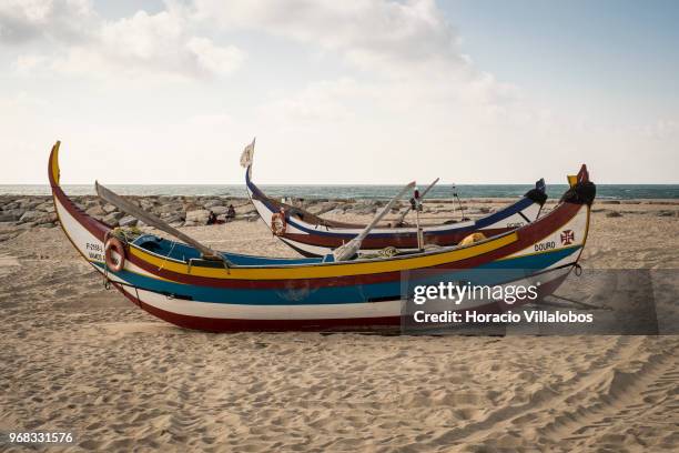 Fishing boats seen on the beach in a Sunday afternoon on May 27, 2018 in Espinho, Portugal. Fishermen do not go out to sea on Sundays and some of...