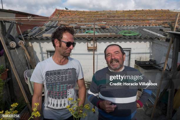 Local fisherman and his son in their house across the street from the beach in a Sunday afternoon on May 27, 2018 in Espinho, Portugal. Fishermen do...
