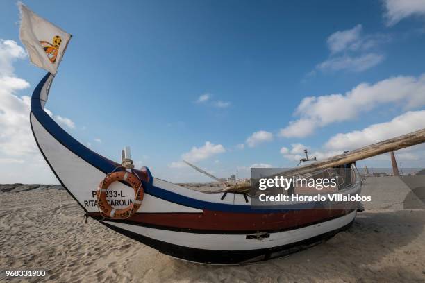 Fishing boats seen on the beach in a Sunday afternoon on May 27, 2018 in Espinho, Portugal. Fishermen do not go out to sea on Sundays and some of...