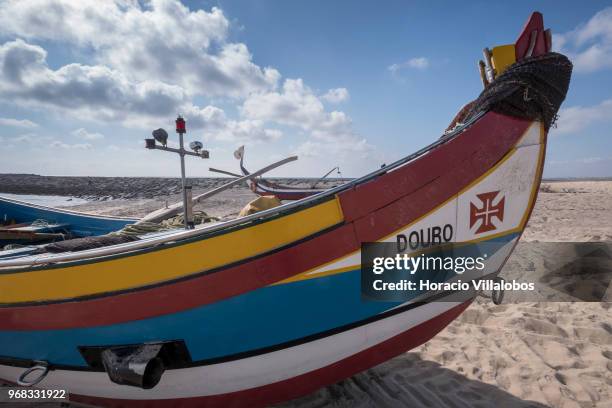 Fishing boats seen on the beach in a Sunday afternoon on May 27, 2018 in Espinho, Portugal. Fishermen do not go out to sea on Sundays and some of...