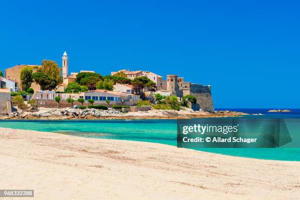 beach and coastline of algajola corsica - corsica stockfoto's en -beelden