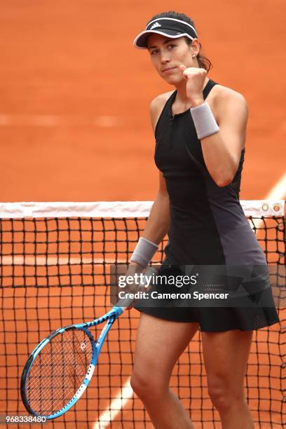 Garbine Murguruza of Spain celebrates victory during the ladies singles quarter finals match against Maria Sharapova of Russia during day eleven of...