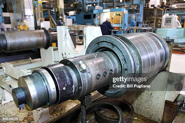 General Motors employee mans his station while working at the GM Bay City Powertrain plant February 18, 2010 in Bay City, Michigan. GM anounced today...