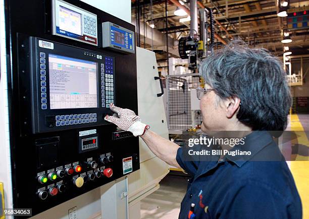 General Motors employee works at her station at the GM Bay City Powertrain plant February 18, 2010 in Bay City, Michigan. GM anounced today that they...