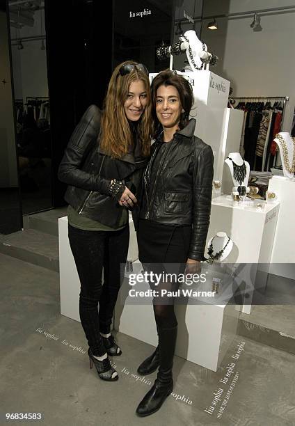 Lia Sophia designer Dani Stahl and company co-owner Ellen Kiam pose in the Lia Sophia Lounge at Alice + Olivia Boutique on February 17, 2010 in New...