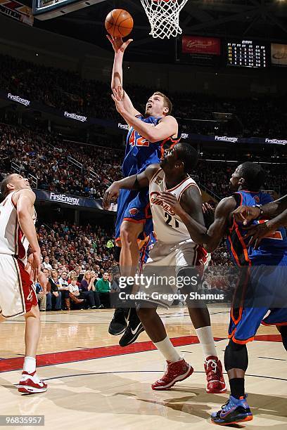 David Lee of the New York Knicks goes to the basket against J.J. Hickson of the Cleveland Cavaliers during the game on February 6, 2010 at Quicken...