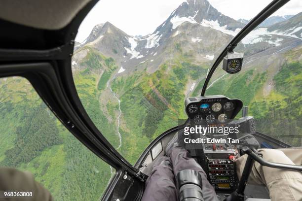 helicopter ride to glacier snow mountain in alaska , usa - inside helicopter stock pictures, royalty-free photos & images