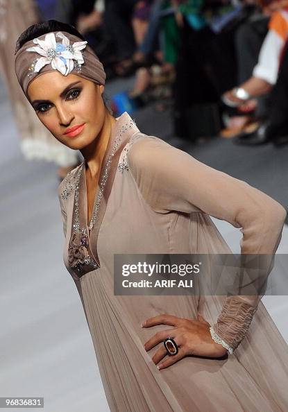 A model presents a creation by Pakistani A model presents a creation by Pakistani