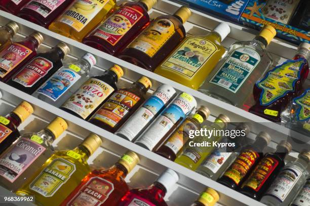 europe, greece, 2017: view of bottles of alcohol for sale in tourist shop - ouzo imagens e fotografias de stock