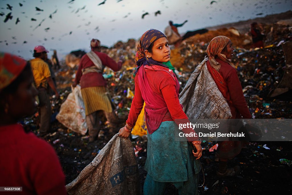 Indian Rag Pickers An Indian worker called a Rag Picker, carries a bag of recyclable ...