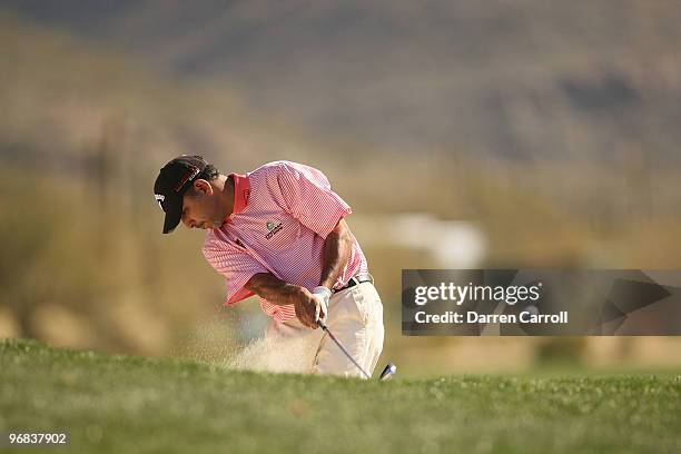 Jeev Milkha Singh of India hits out of the bunker on the second hole during round two of the Accenture Match Play Championship at the Ritz-Carlton...