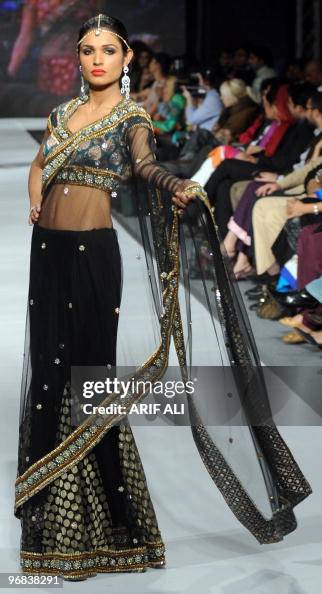 A model presents a creation by Pakistani A model presents a creation by Pakistani