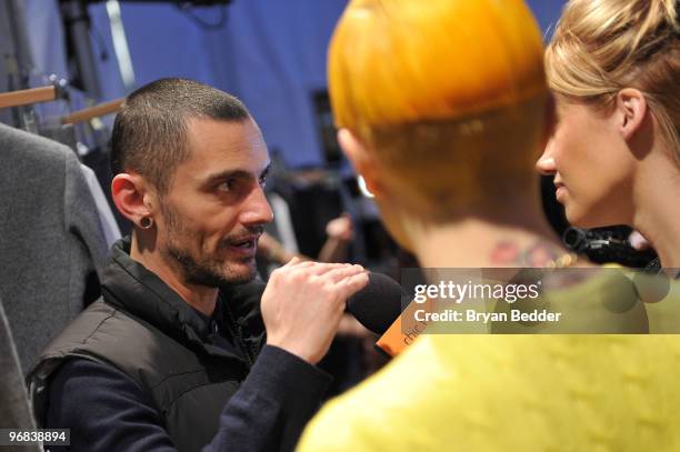 Designer Davidelfin interviews backstage at the Davidelfin Fall 2010 Fashion Show during Mercedes-Benz Fashion Week at the Salon at Bryant Park on...