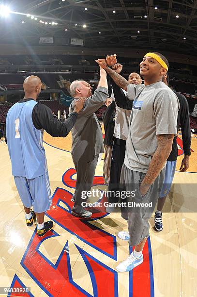 Head coach George Karl huddles up with Chauncey Billups, Kenyon Martin, Nene and Carmelo Anthony of the Denver Nuggets during practice prior to the...