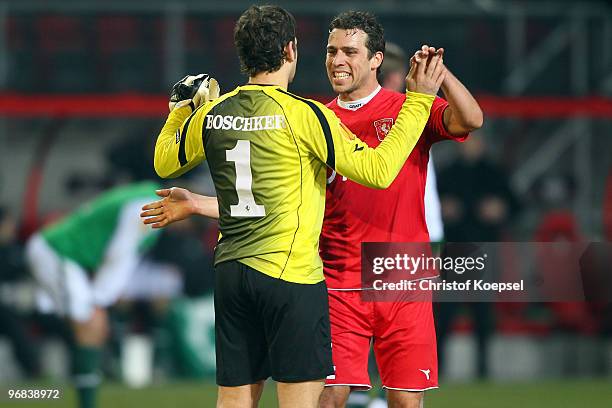 Sander Boschker of Enschede and Peter Wisgerhof celebrate the 1-0 victory after the UEFA Europa League knock-out round, first leg match between FC...