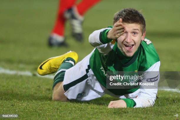 Marko Marin of Bremen lies on the pitch and shouts during the UEFA Europa League knock-out round, first leg match between FC Twente Enschede and SV...