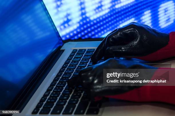 programmer or computer hacker typing code on laptop keyboard - web programmer stock pictures, royalty-free photos & images