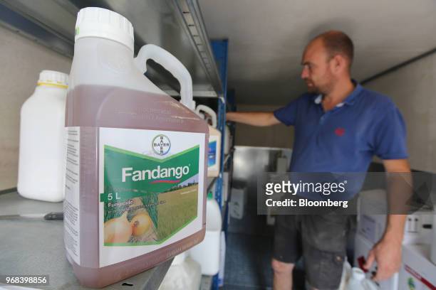 Bottle of Fandango fungicide, produced by Bayer CropScience AG, sits on a storage shelf as a famer selects crop care products on his farm in Abbenes,...