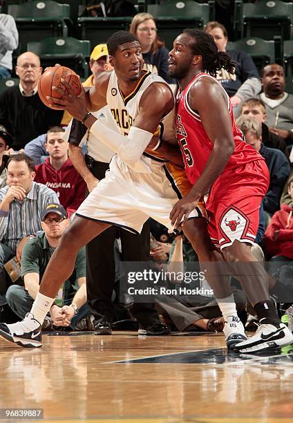 Roy Hibbert of the Indiana Pacers posts up against Chris Richard of the Chicago Bulls during the game on February 9, 2010 at Conseco Fieldhouse in...