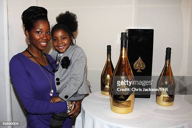 Singer Jamelia and her daughter sign a one-off Jeroboam of Armand de Brignac Champagne which was auctioned for Naomi Campbell's Fashion For Relief...
